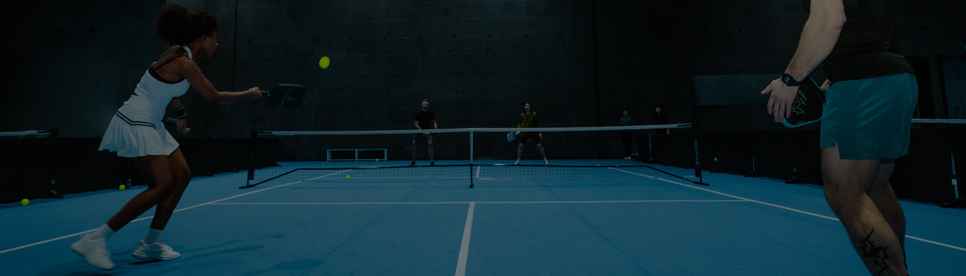 Players on a pickleball court, illustrating the RC Difference